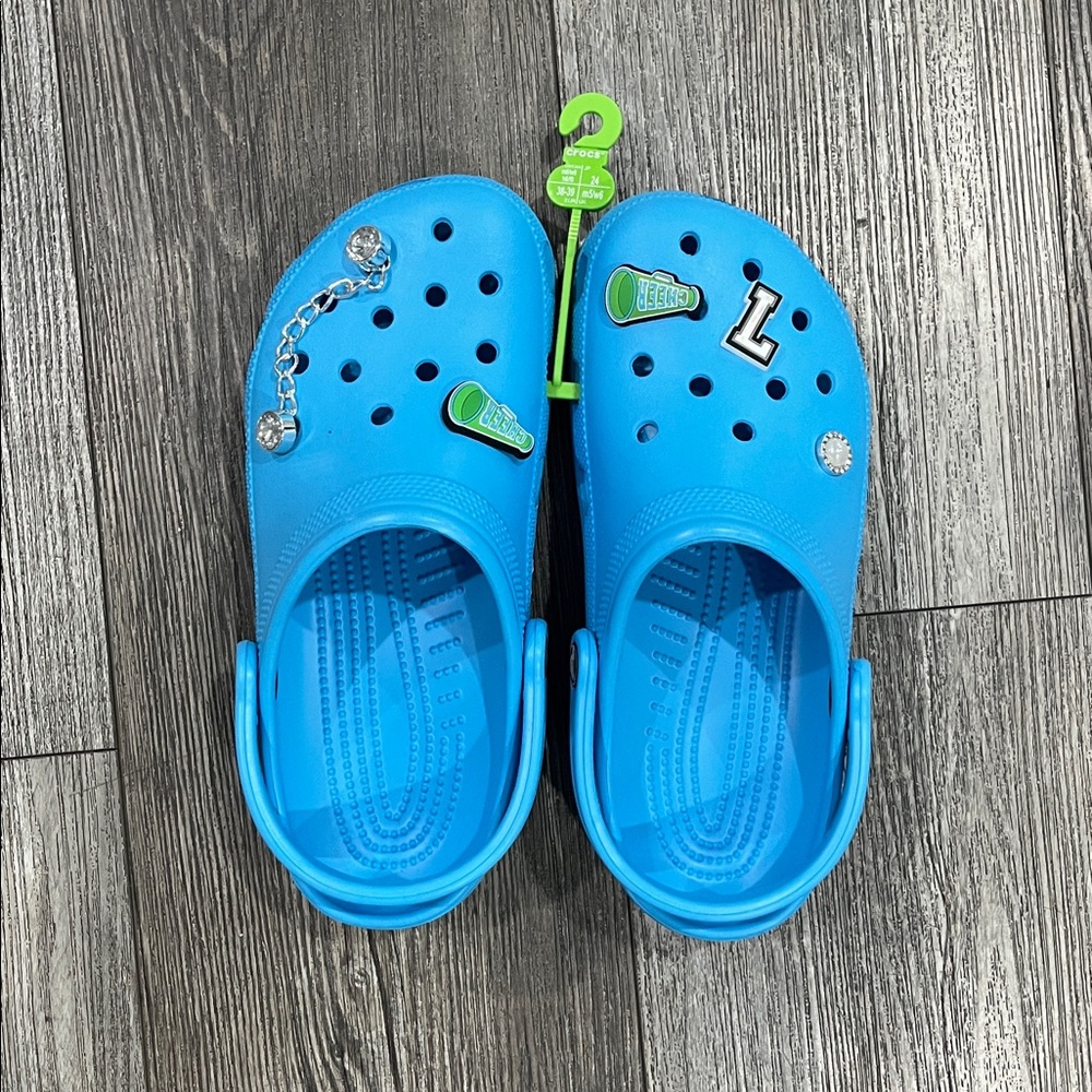 CROCS Vibrant Blue Clogs with Charms brand new never worn with charms